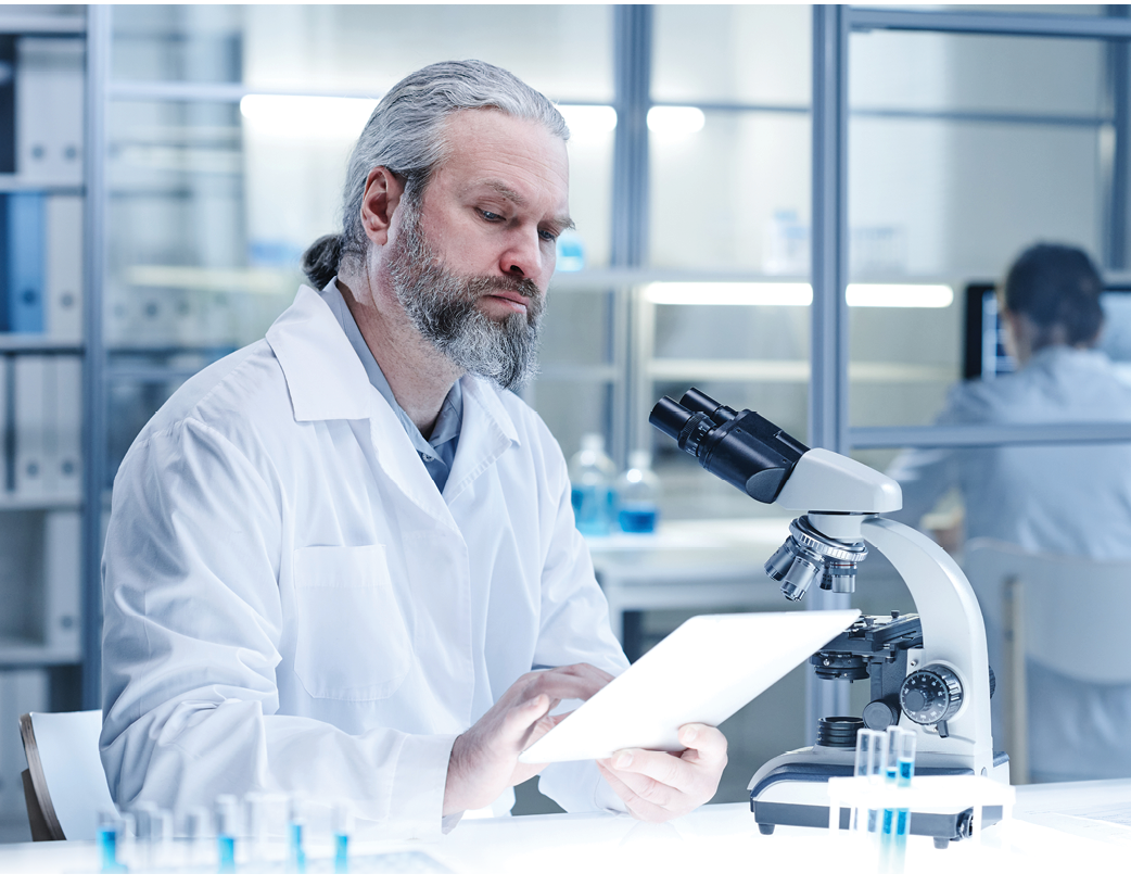 Man working on tablet pc at lab