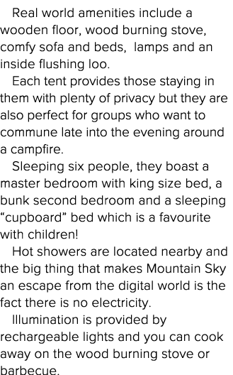 Real world amenities include a wooden floor, wood burning stove, comfy sofa and beds, lamps and an inside flushing lo   