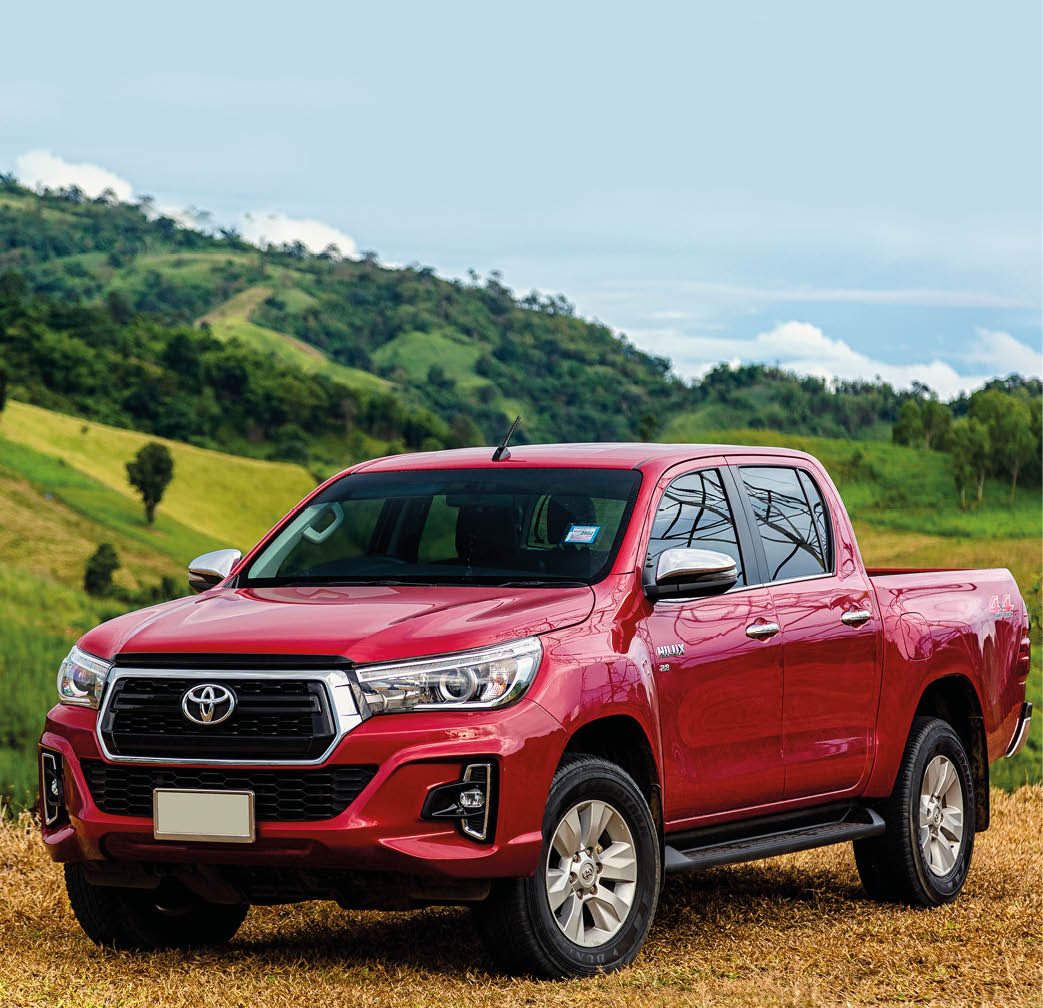 petchaburi,Thailand:20-November-2018:Red Toyota Hilux Revo parking at the green mountain