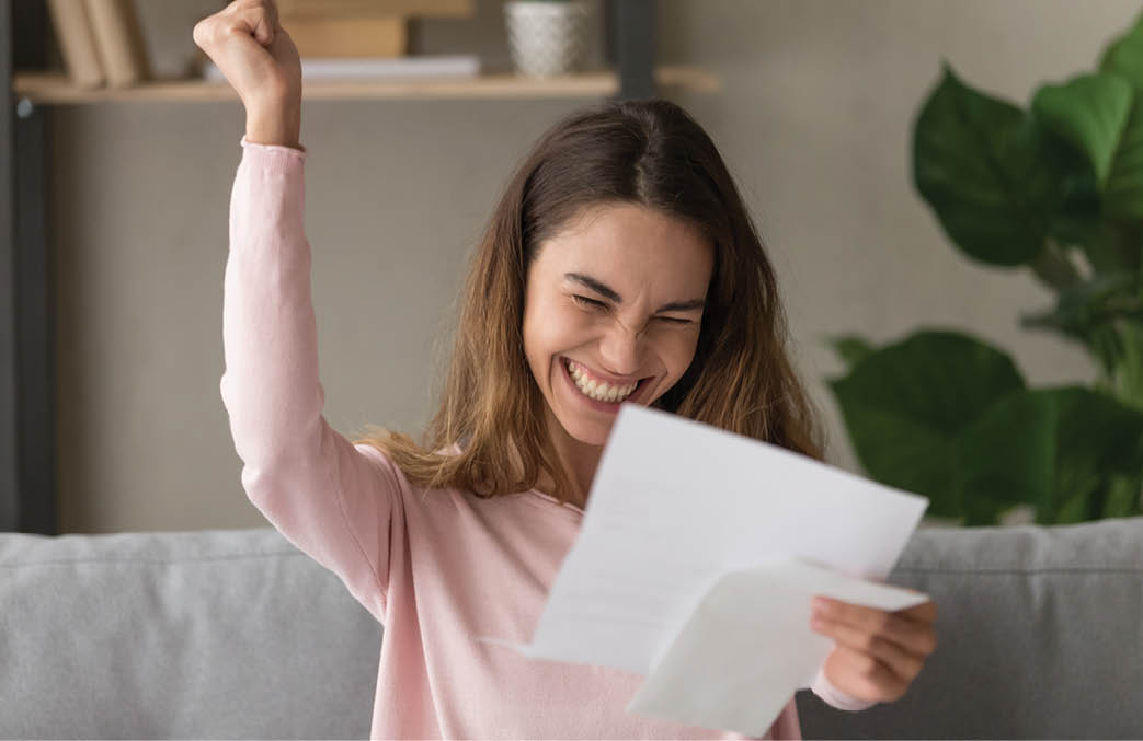 Excited young woman hold paper letter feel euphoric receiving job promotion or tax refund from bank, happy girl reading paperwork document smiling of good pleasant news, getting student scholarship
