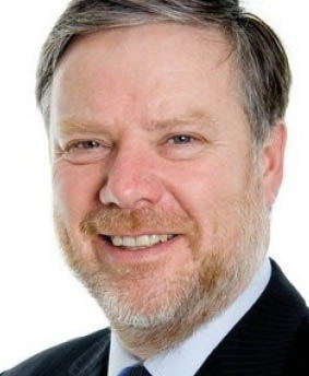 A person smiling for the camera Description automatically generated