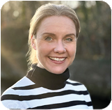 A person smiling for the camera Description automatically generated