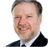 A person smiling for the camera Description automatically generated