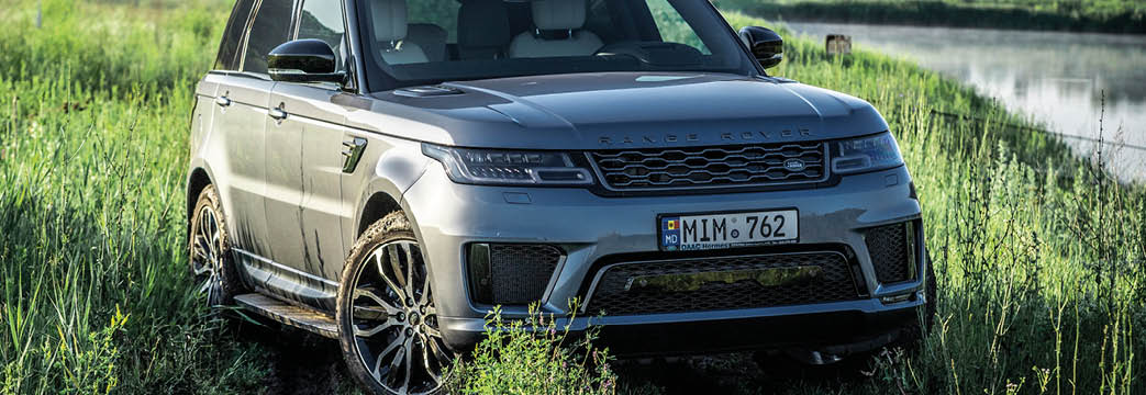 Chisinau, moldova - june 27 2020: Land Rover Range Rover Sport Phev in green field