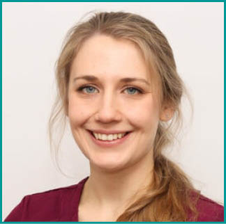 A woman wearing a maroon shirt with a name tag on it. AI generated content