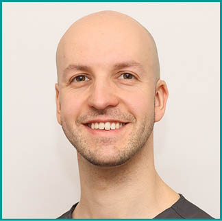 A man wearing a white shirt and a name tag that says “Dr. Almanheim" is smiling for the camera. AI generated content