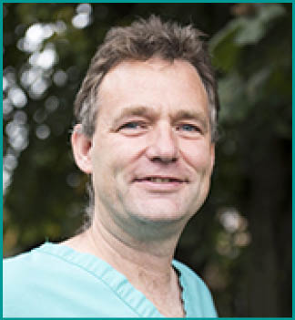 A man wearing a blue shirt and tie is smiling for the camera. AI generated content