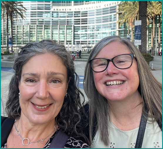 Two women posing for a picture in front of a building. AI generated content