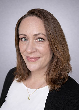 A woman with blonde hair is smiling for the camera. AI generated content