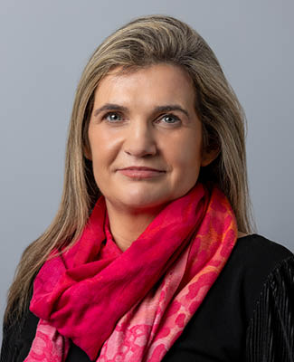 A woman wearing a red scarf and black shirt. AI generated content