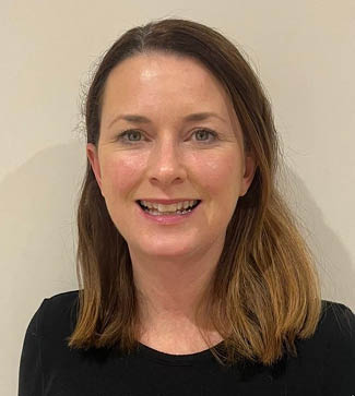 A woman with a smile on her face and a black shirt. AI generated content