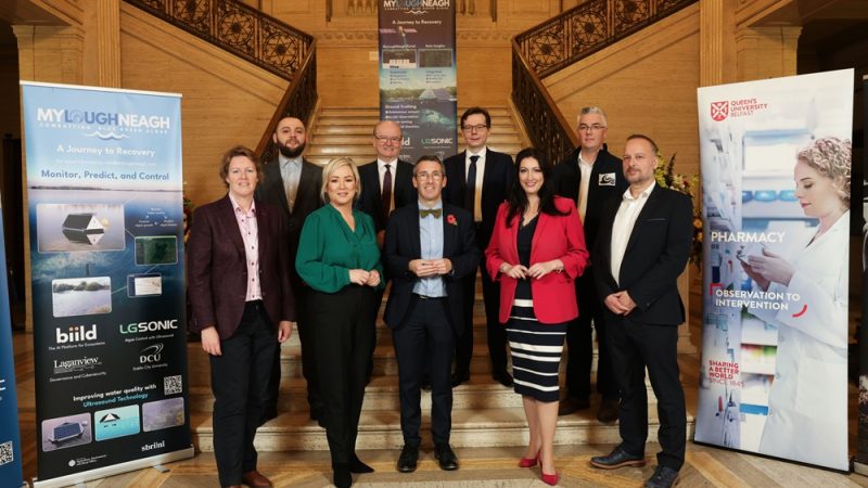 irst Minister Michelle O’Neill and deputy First Minister Emma Little-Pengelly along with Minister Muir is pictured with the five successful suppliers of Phase one of the Lough Neagh: Blue-Green Algae Small Business Research Initiative (SBRI).